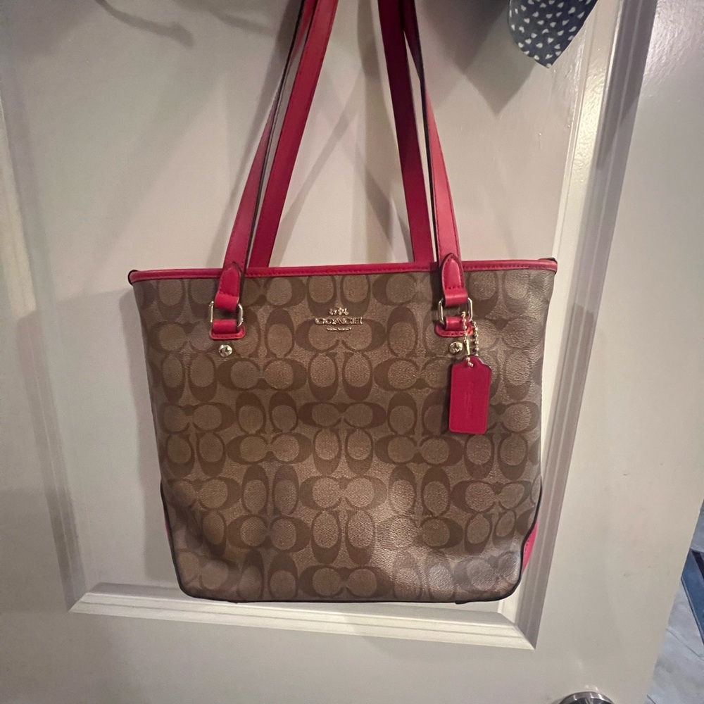 Pink and tan Coach purse.